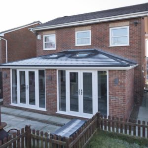 Orangery with a solid roof and two sets of French doors