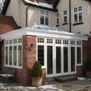 Glass roof with white upvc on a brick orangery